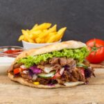 imgi_23_doner-kebab-doner-kebap-fast-food-flatbread-with-fries-wooden-board-square_770123-1264