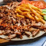imgi_33_side-view-doner-pita-with-french-fries-fresh-cucumber-tomato_141793-4970
